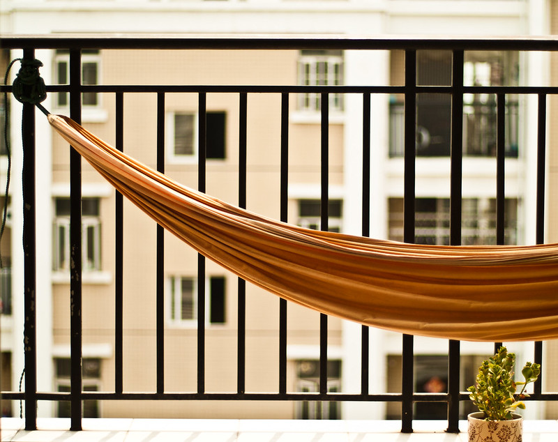 A hammock on a small balcony