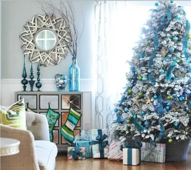 A bright blue and white Christmas tree