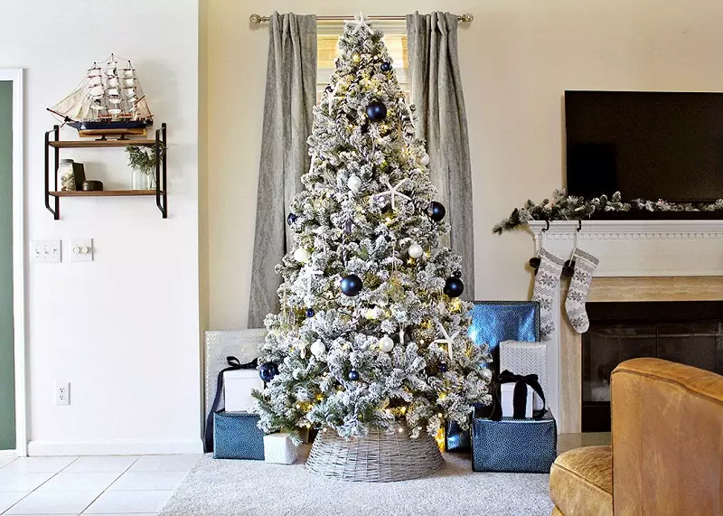 A minimalist blue and white Christmas tree