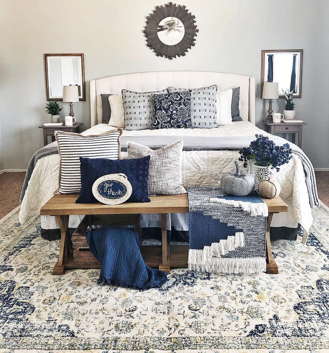 A dark blue bedroom and gold - glamour style