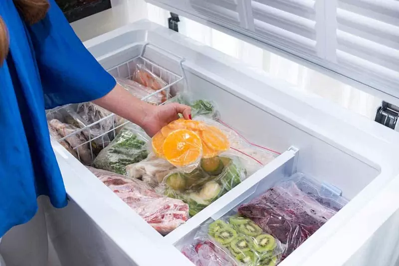 How to speed up the process of defrosting a freezer?
