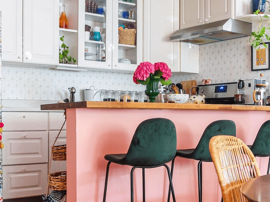 A colorful windowless kitchen