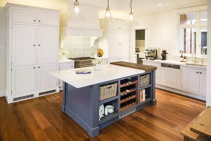 A small Hamptons style kitchen with an island