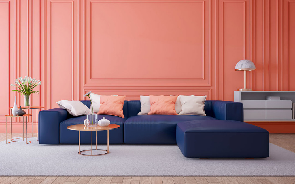 Indigo sofa and a pink wall