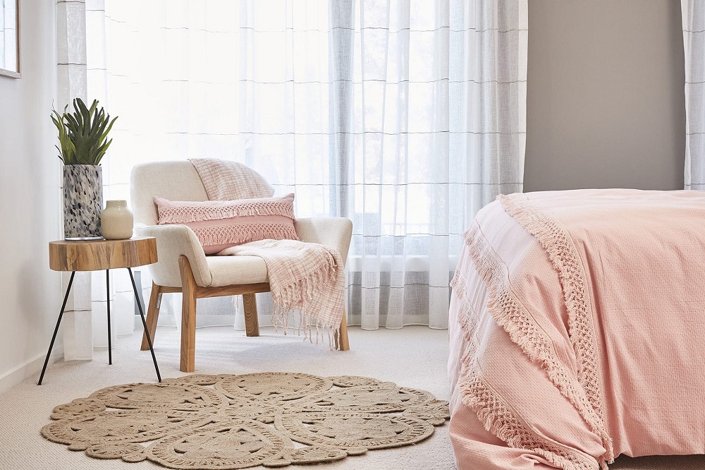 A feminine Boho living room featuring pink