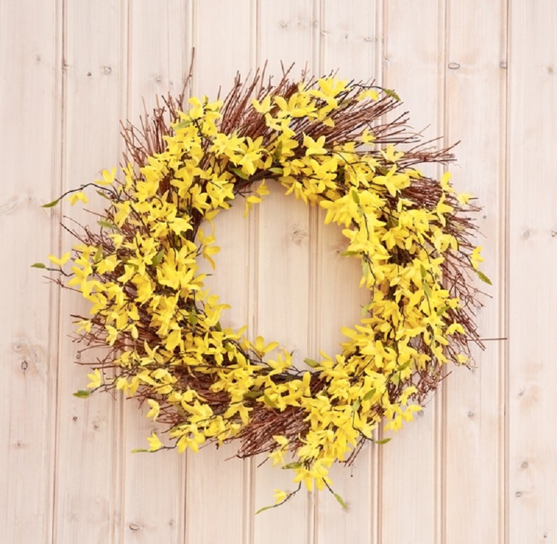 Easter wreath made of hay and forsythia
